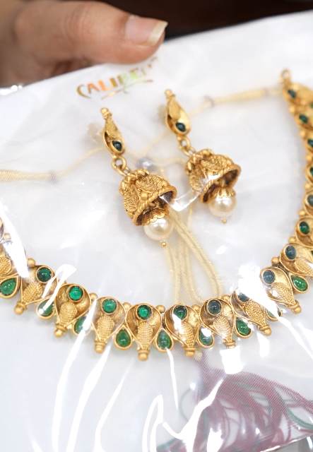Necklace Set -Golden color and green color stones Search code 6119
