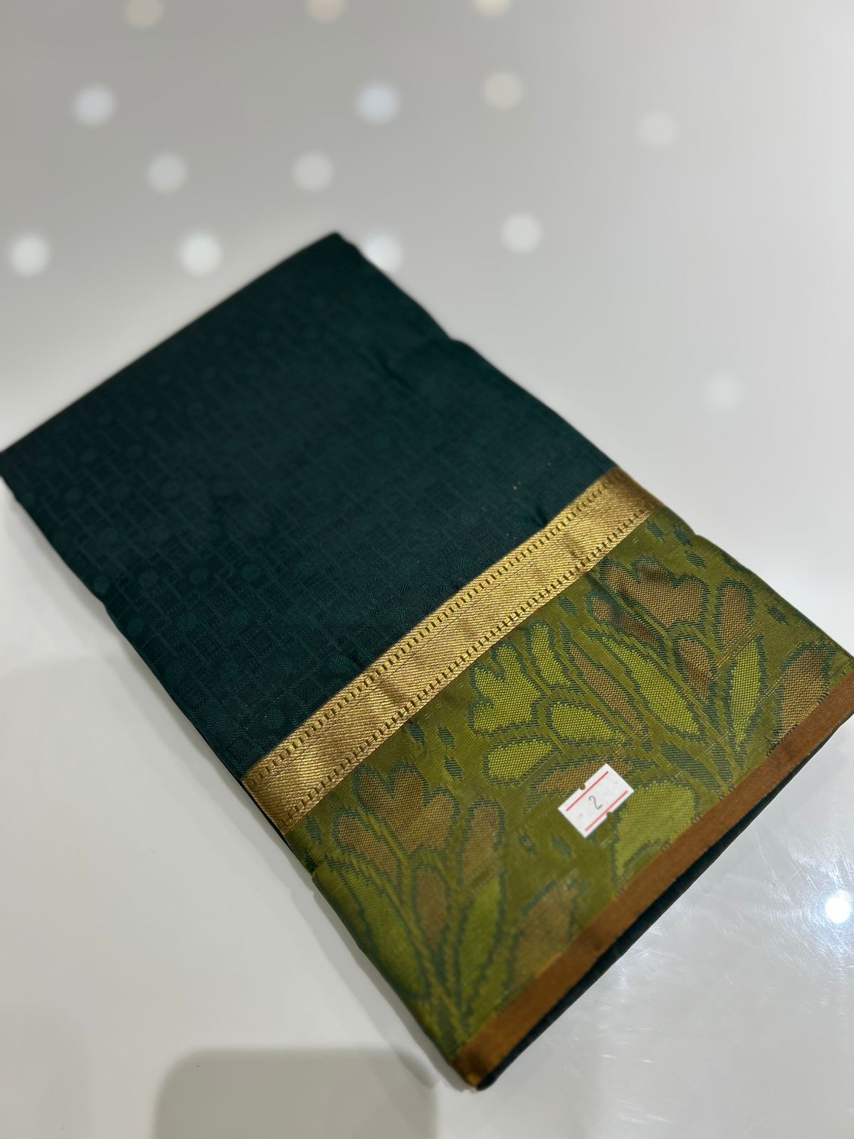kanchipuram self imposing saree-  Bottle green Search code 6004